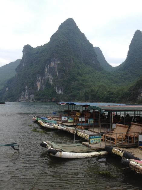 bamboo rafts in the Li River against a mountain landscape